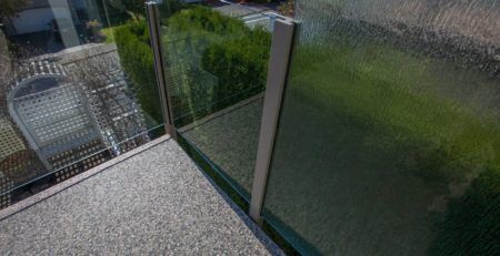 Vinyl covered deck with opaque glass wall