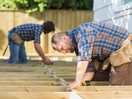 2 carpenters building a new deck