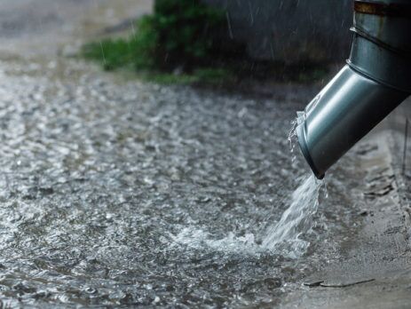 RAINWATER POURING OUT OF DOWN PIPE