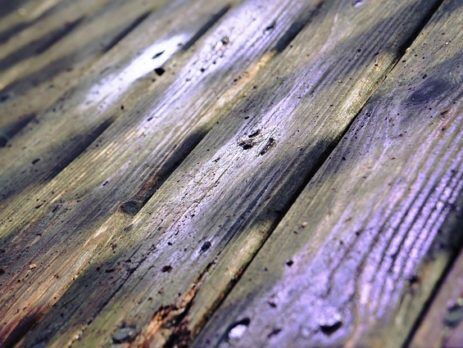 IMAGE OF DAMAGED WOODEN DECK SURFACE