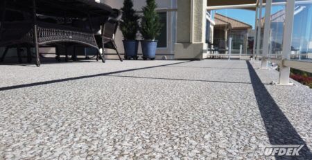 View from deck surface of Designer Aggregate Waterproof Vinyl Decking Installation