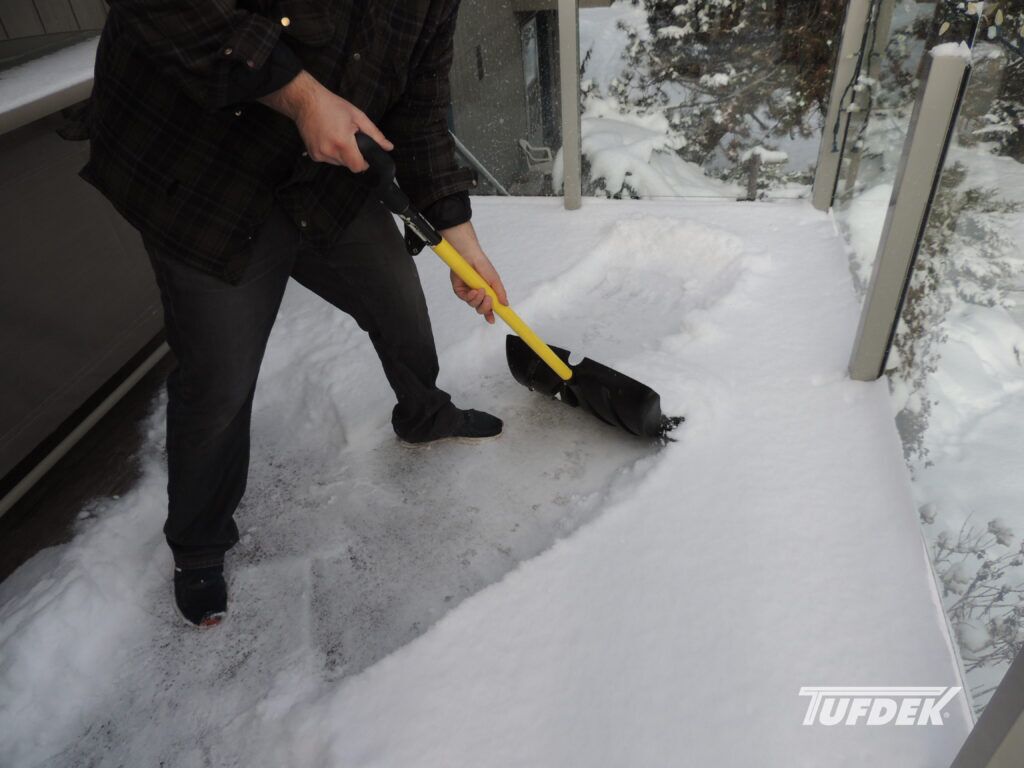 How To Winter Proof Your Deck? How To Winter Proof Your Deck against snow and moisture - man shovelling deck snow