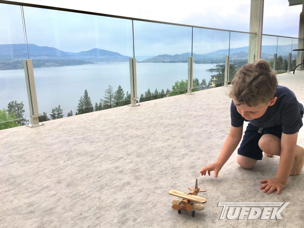 IMG_E3055-2-1024x768-edit Child playing with toy on vinyl deck with view of lake in background