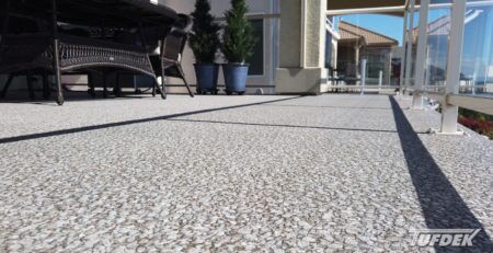 View from deck surface of Designer Aggregate Waterproof Vinyl Decking Installation