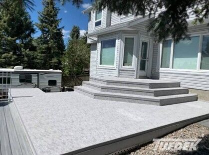Tufdek waterproof vinyl decking installed on an outdoor deck and deck stairs.