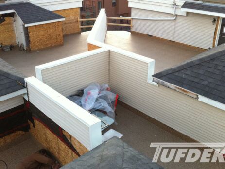 Vinyl covered flat roof decks in multi unit complex