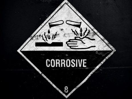 Danger sign showing corrosive warning