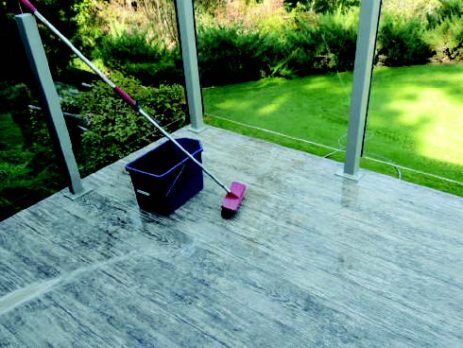 Mop and bucket on a wet vinyl covered deck