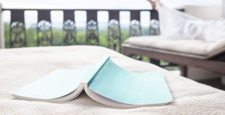 BOOK FACE DOWN ON DECK FURNITURE