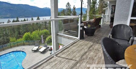 Waterproof vinyl deck with lake view and overlooking a pool