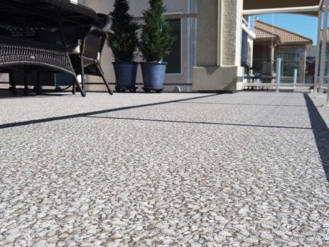 View from deck surface of Designer Aggregate Waterproof Vinyl Decking Installation