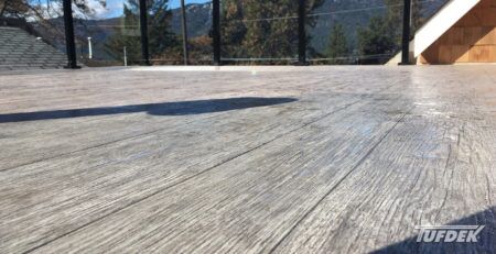 View at floor level of Tufdek vinyl decking installation